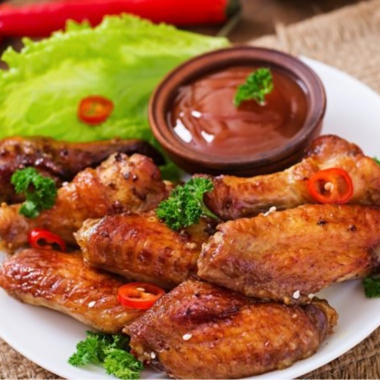 sour-sweet-baked-chicken-wings-and-sauce-PYAGX99-768x460